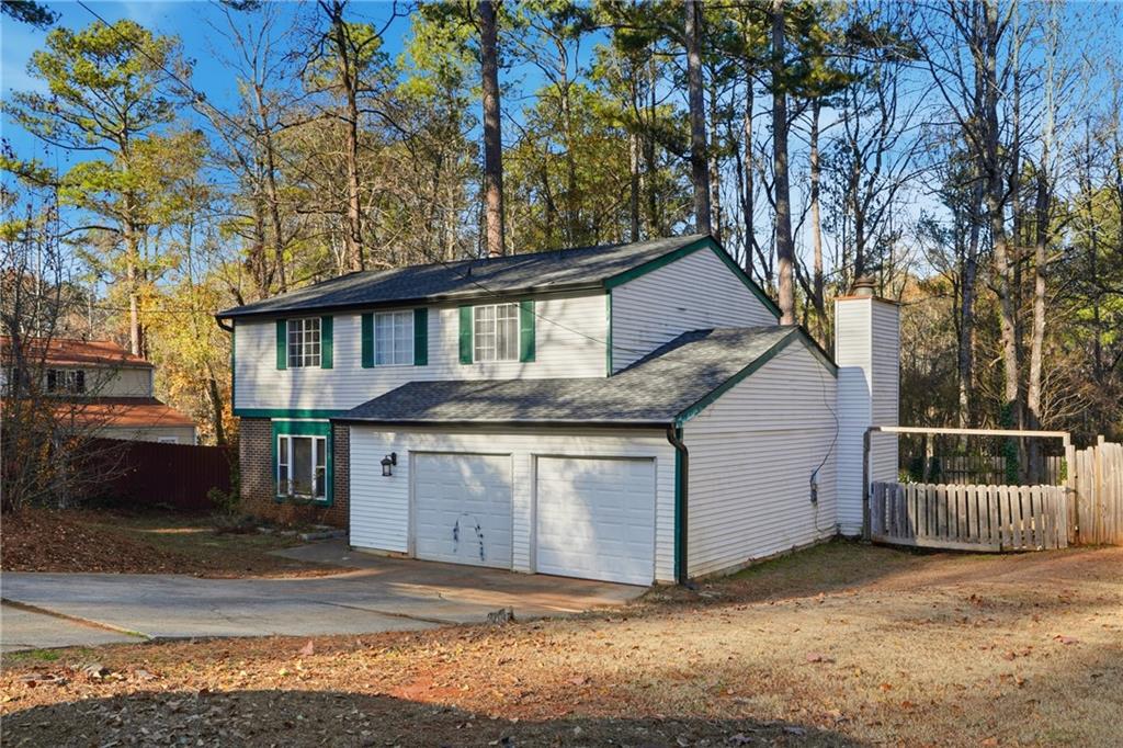 4828 Oak Path Stone Mountain, GA 30088 - Photo 2 of 40 a front view of a house with a yard