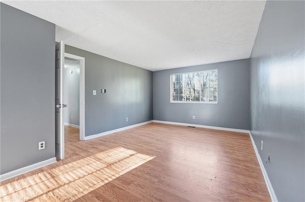 4828 Oak Path Stone Mountain, GA 30088 - Photo 24 of 40 a view of an empty room and window