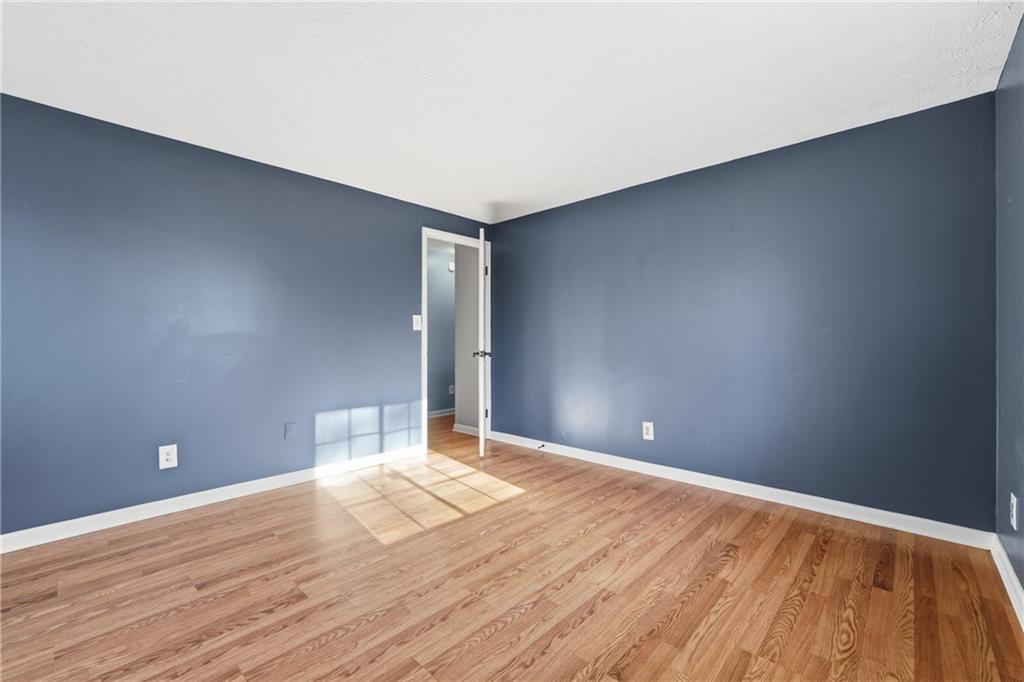 4828 Oak Path Stone Mountain, GA 30088 - Photo 34 of 40 a view of empty room with wooden floor