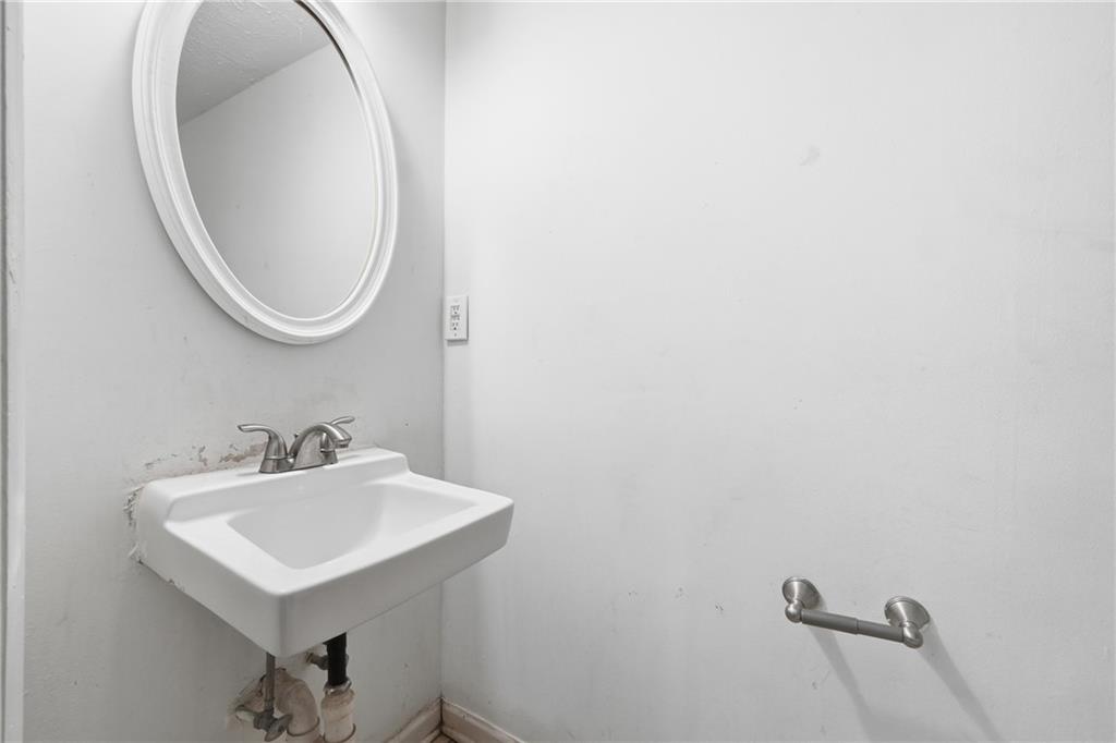 4828 Oak Path Stone Mountain, GA 30088 - Photo 35 of 40 a bathroom with a sink and a mirror