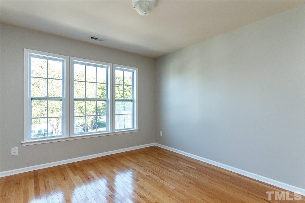 8306 Pilots View Drive Raleigh, NC 27617 - Photo 22 of 30 Freshly painted with beautiful hardwoods in all bedrooms.