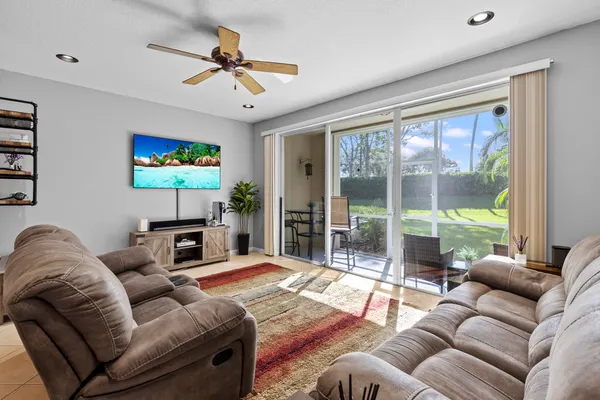 a view of a room with a furniture and floor to ceiling window