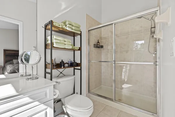 a living room with lots of furniture and clutter