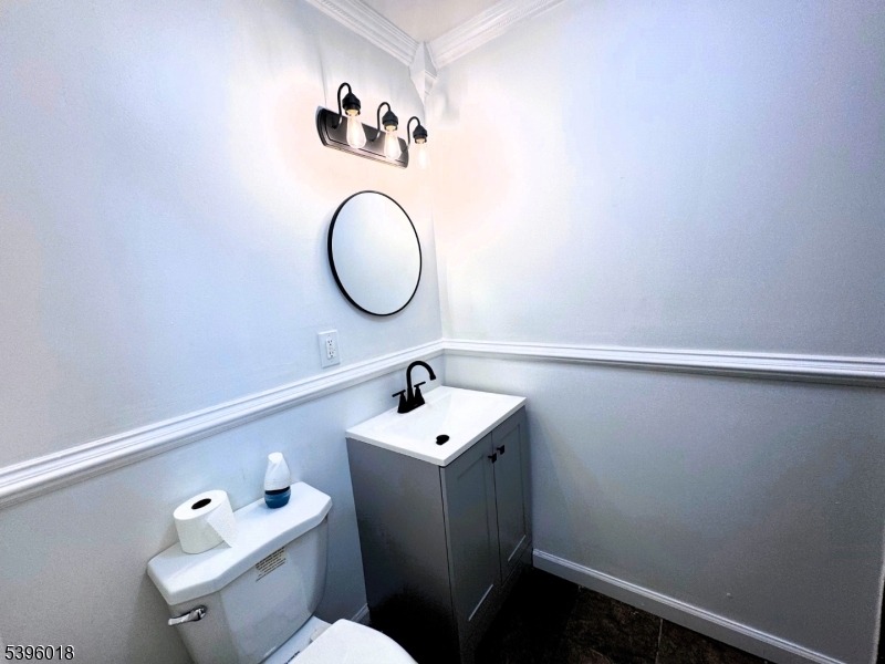 158 Catherine Street, Unit B Elizabeth, NJ 07201 - Photo 6 of 14 a bathroom with a sink mirror and toilet