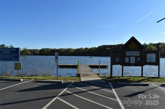 a view of a swimming pool with a lake view