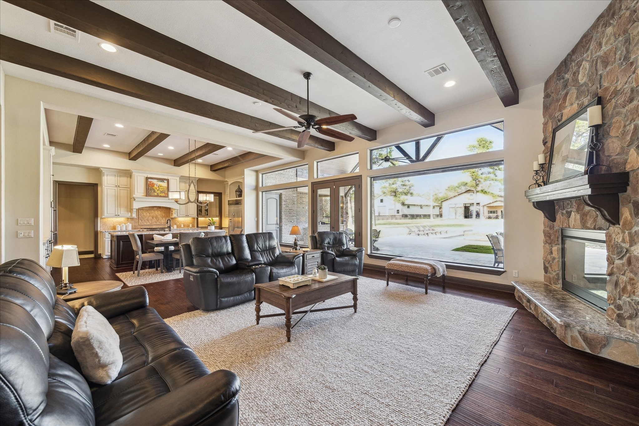 11 Willowcreek Ranch Road Tomball, TX 77377 - Photo 19 of 49 The family room boasts wide open spaces and views beyond through a wall of windows, transoms and French doors.