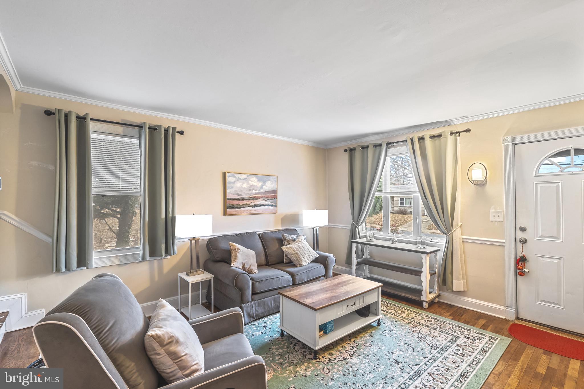 8362 Oakleigh Road Parkville, MD 21234 - Photo 2 of 28 a living room with furniture and a window