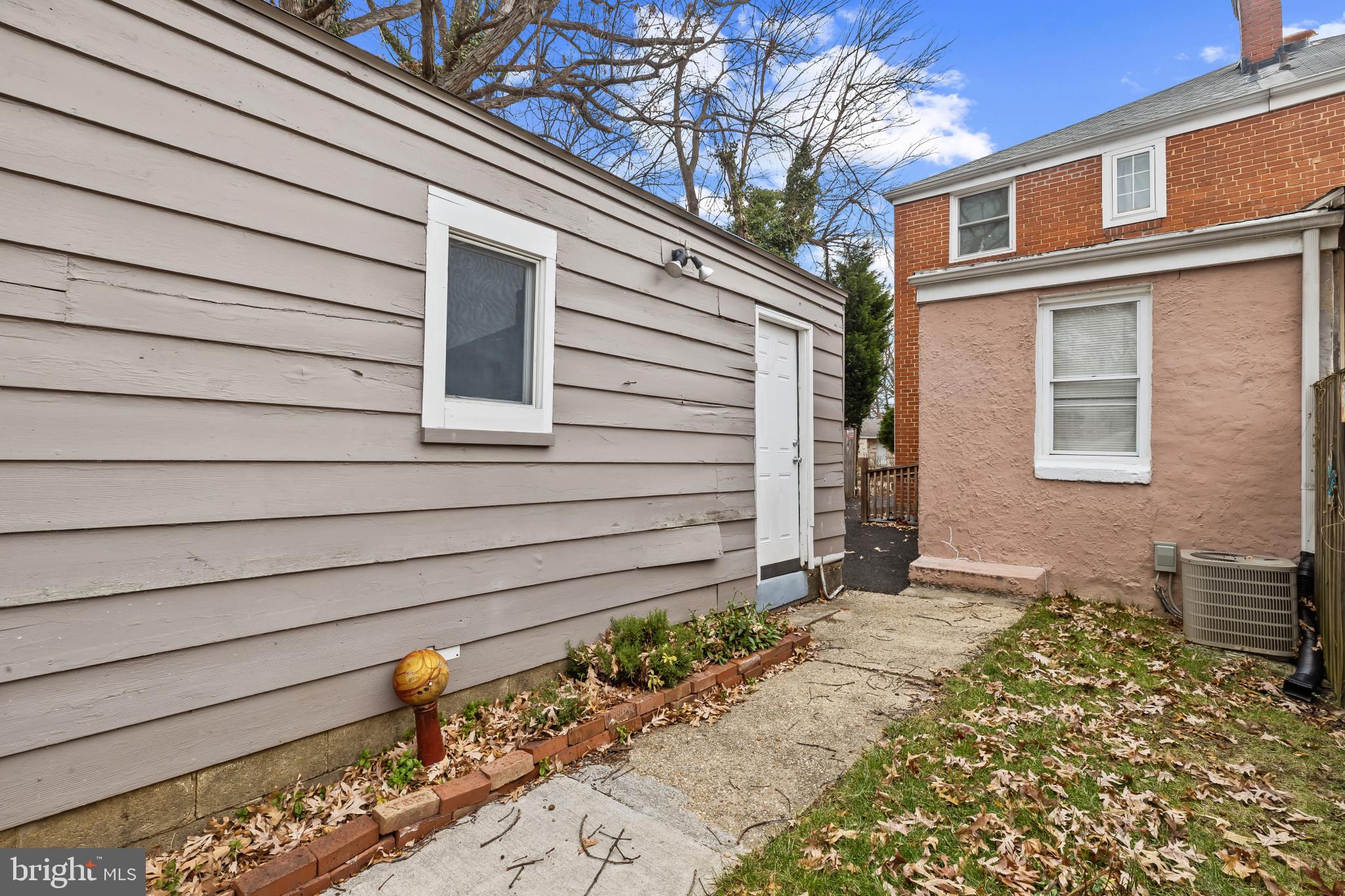 8362 Oakleigh Road Parkville, MD 21234 - Photo 25 of 28 a front view of a house with a yard