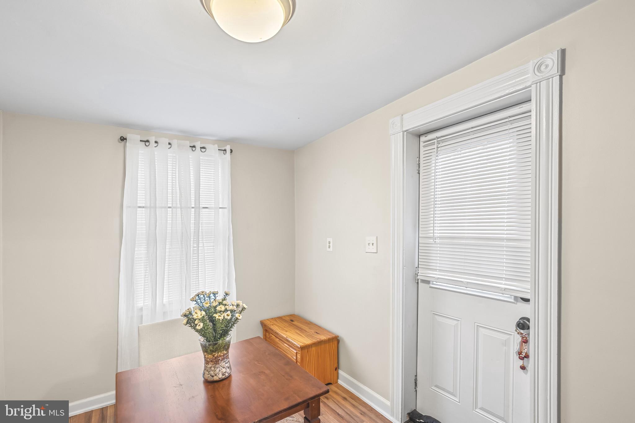8362 Oakleigh Road Parkville, MD 21234 - Photo 10 of 28 a view of a room with table and chair