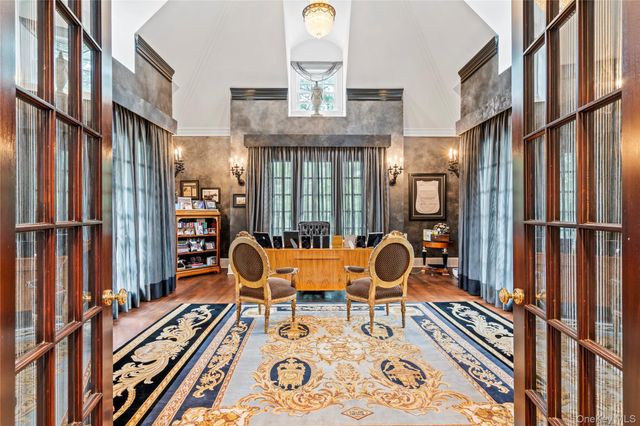 a bathroom with a sink mirror and a bathtub with shower