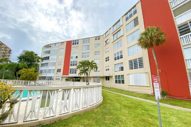 a kitchen with granite countertop a sink and stainless steel appliances