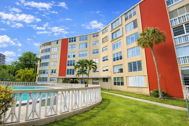 a view of a building with a yard