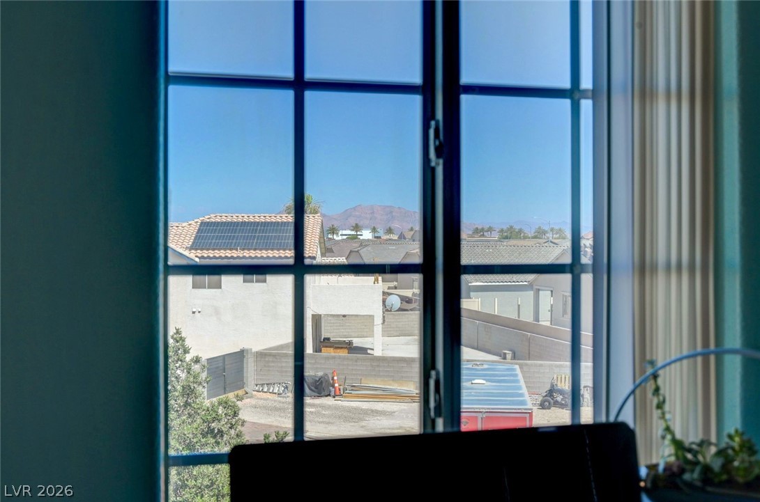 3318 North Decatur Boulevard, Unit 2072 Las Vegas, NV 89130 - Photo 29 of 50 Framed by window panes, a distant mountain range offers a picturesque desert view.