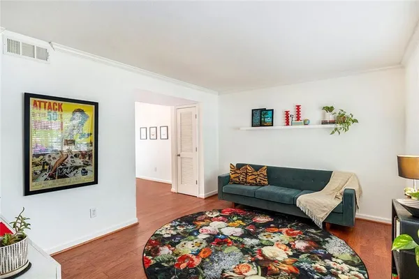 a living room with furniture and a rug