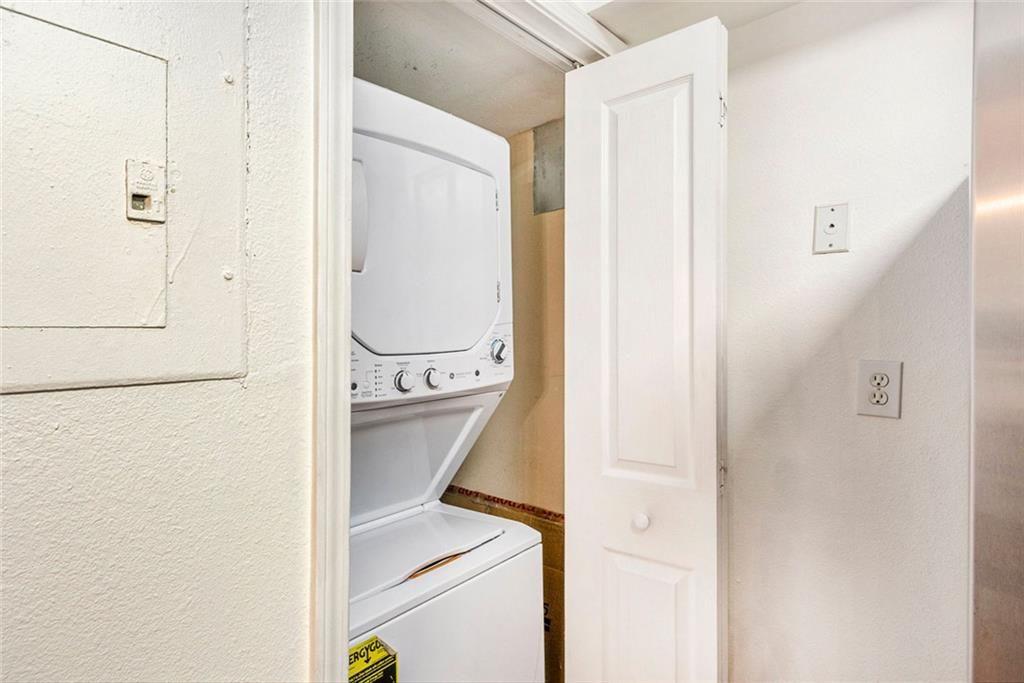 6940 Roswell Road, Unit 16B Atlanta, GA 30328 - Photo 13 of 27 a utility room with dryer and washer