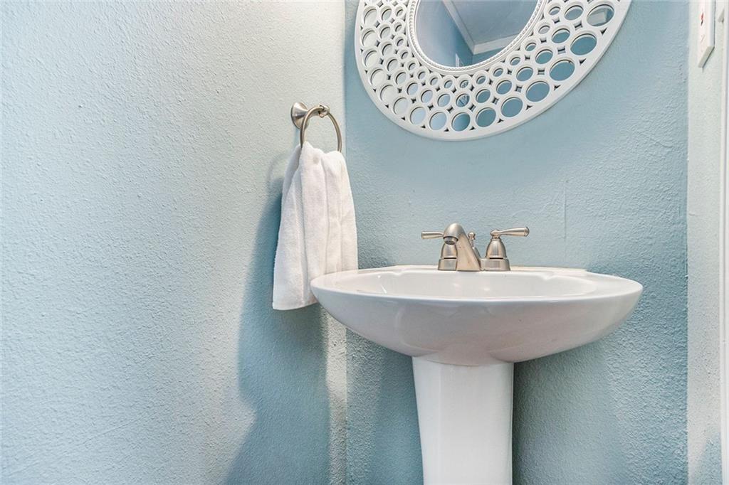 6940 Roswell Road, Unit 16B Atlanta, GA 30328 - Photo 14 of 27 a bathroom with a sink and a mirror