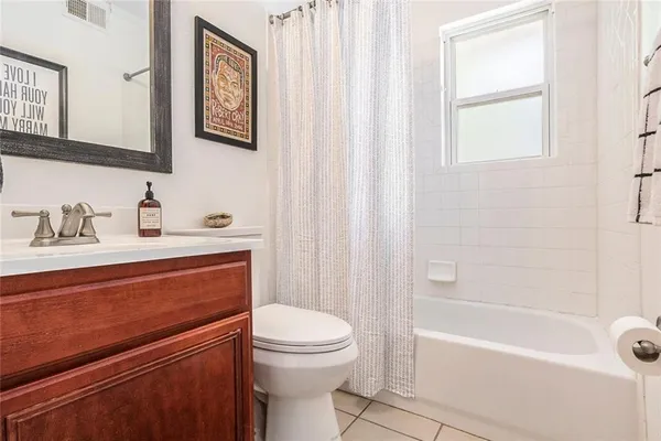 a bathroom with a sink a toilet and a bathtub