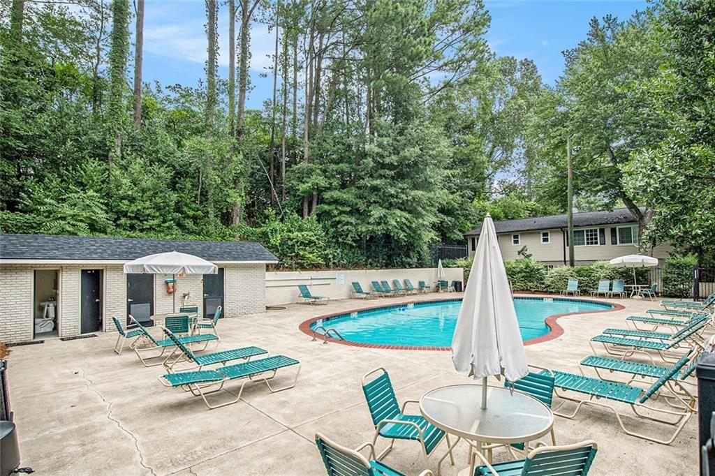 6940 Roswell Road, Unit 16B Atlanta, GA 30328 - Photo 26 of 27 a swimming pool with outdoor seating yard and patio
