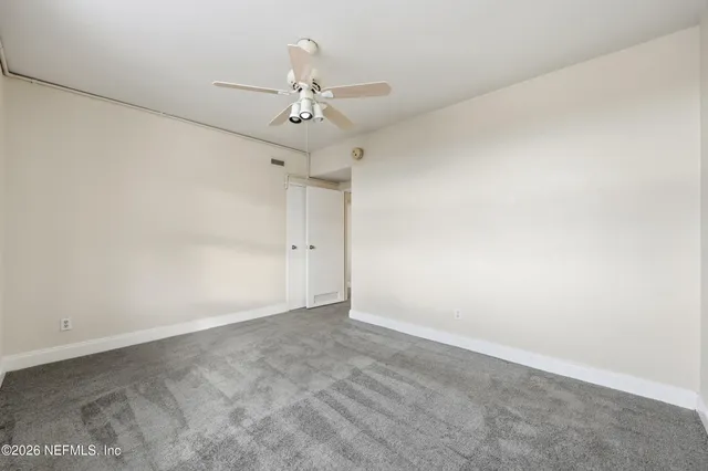 a bathroom with a granite countertop toilet