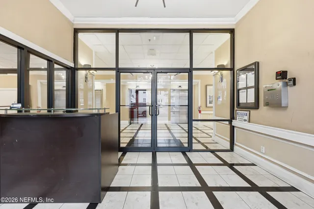 a view of a floor to ceiling window with a glass door