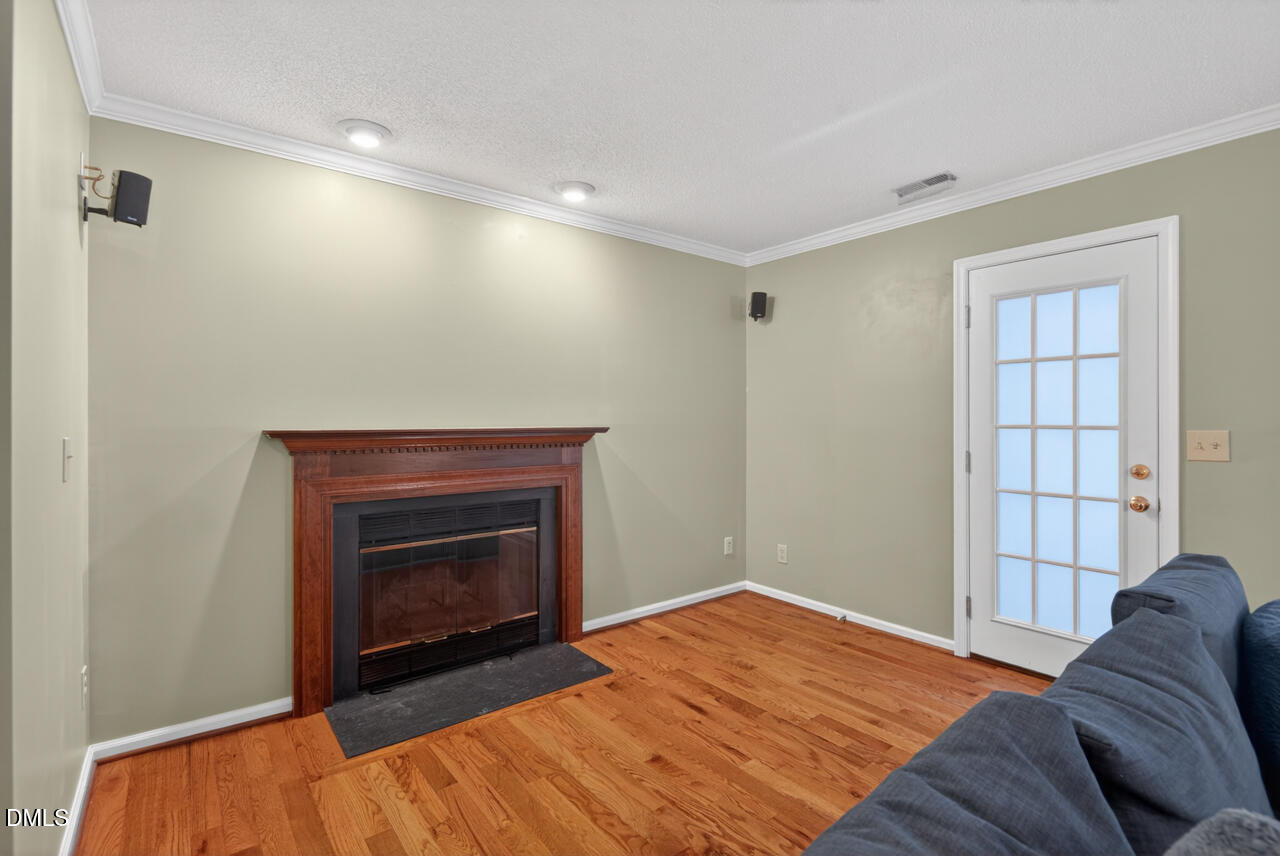 3307 Coachman's Way Durham, NC 27705 - Photo 22 of 50 a bedroom with a bed and a fireplace