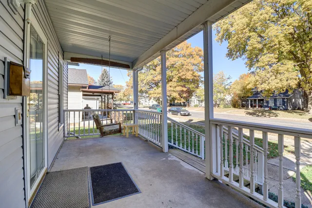 a view of a porch with wooden floor and outdoor space