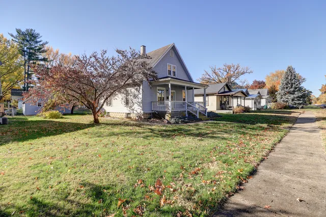 a front view of a house with a yard