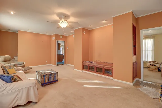 a bedroom with furniture and a chandelier