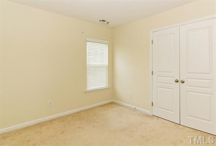 3407 Ranbir Drive Durham, NC 27713 - Photo 20 of 25 The 2nd bedroom offers a double closet with neutral carpeting! Bedroom