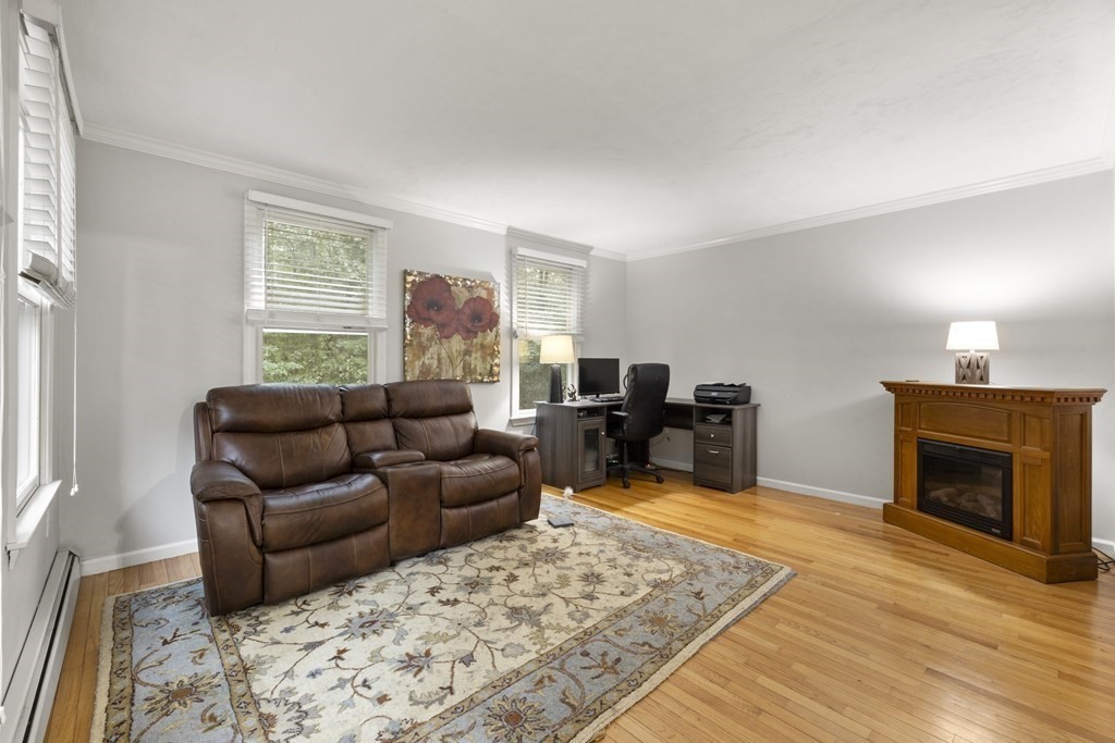 3 Daniels Road Medway, MA 02053 - Photo 14 of 28 a living room with furniture or couch and a fireplace