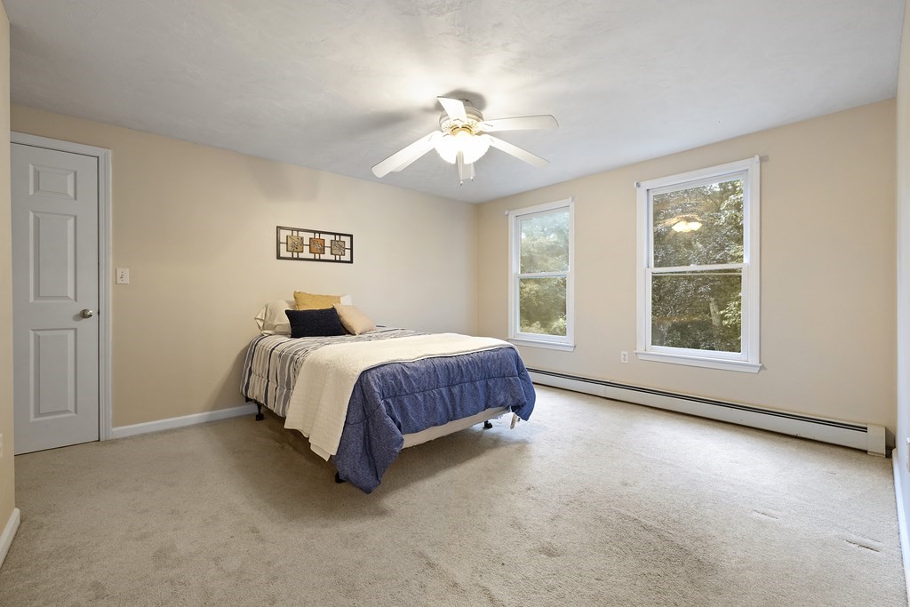3 Daniels Road Medway, MA 02053 - Photo 17 of 28 a spacious bedroom with a large bed and a window
