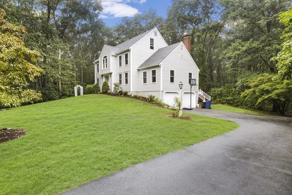 3 Daniels Road Medway, MA 02053 - Photo 2 of 28 a view of a white house in front of a big yard with large trees