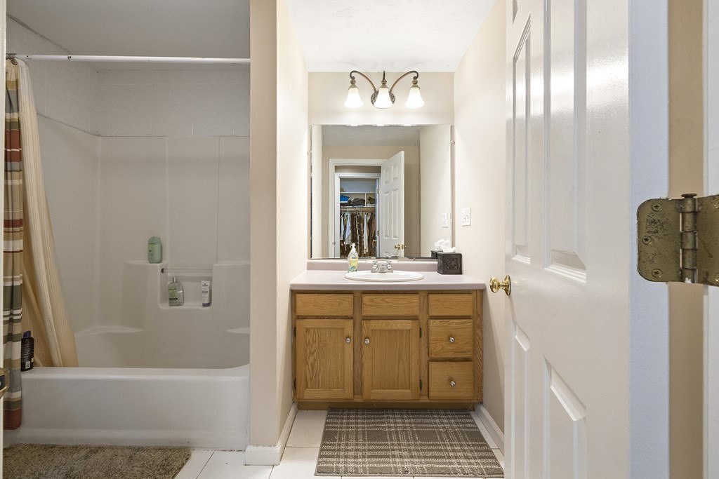 3 Daniels Road Medway, MA 02053 - Photo 23 of 28 a bathroom with a granite countertop sink a toilet and shower