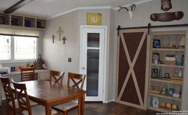 a view of a dining room with furniture