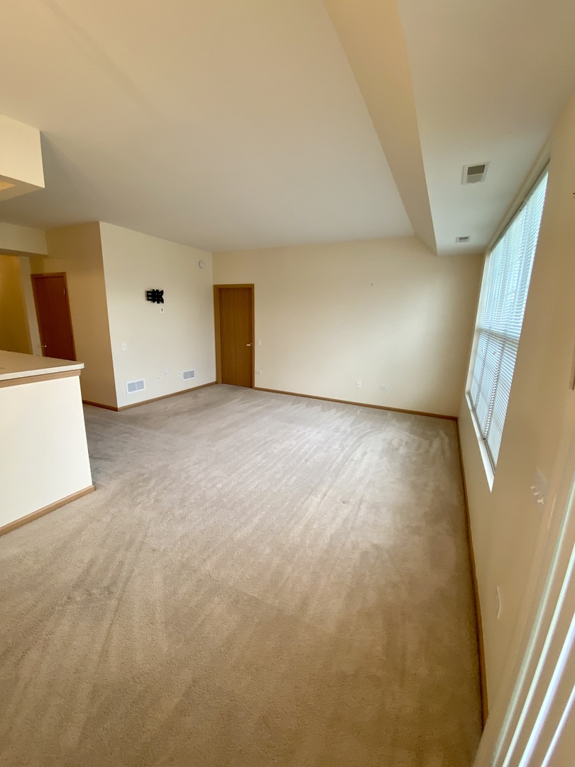 13489 Delaney Road Huntley, IL 60142 - Photo 8 of 17 a view of an empty room with a window