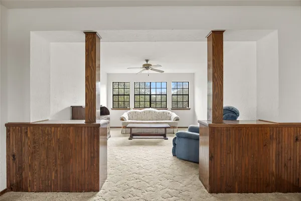 wooden floor in an empty room and a window