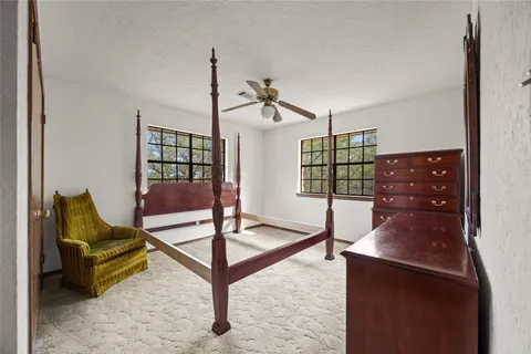 a bed room with a bed and a window