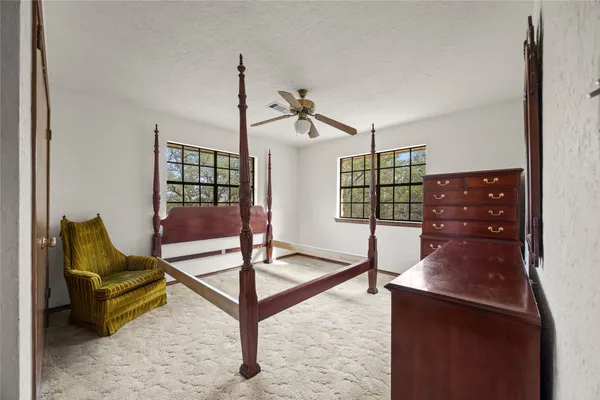 a bed room with a bed and a window