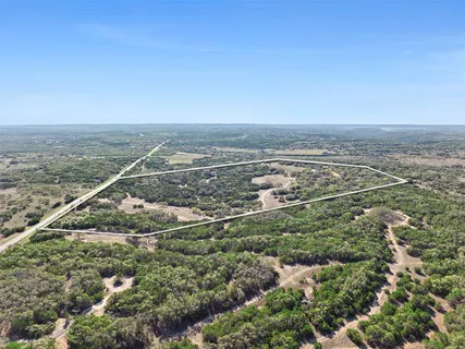 an aerial view of house with yard