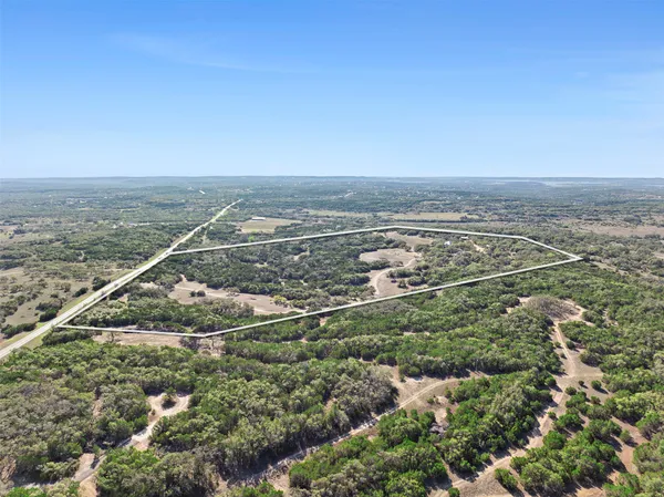 an aerial view of house with yard
