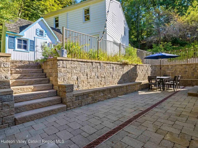 a view of a house with a wooden deck
