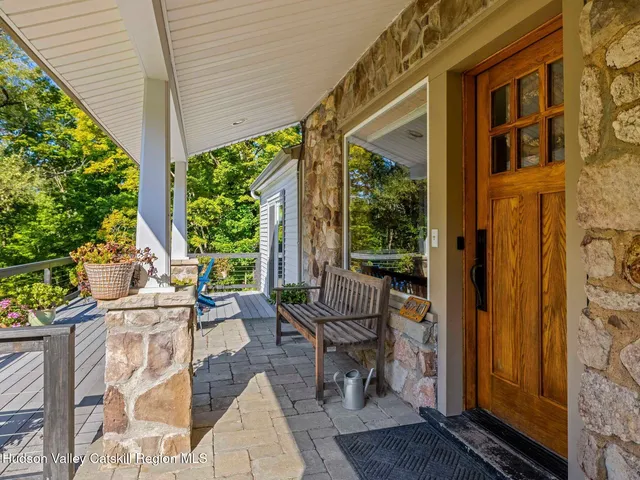 a view of a patio with table and chairs and potted plants