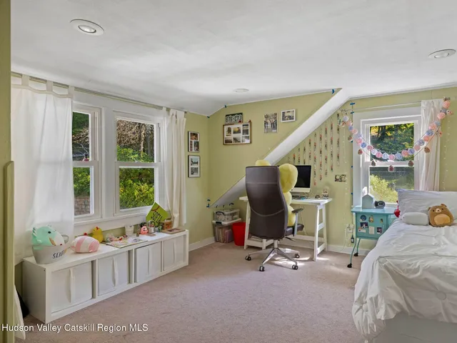a view of a livingroom with furniture and windows