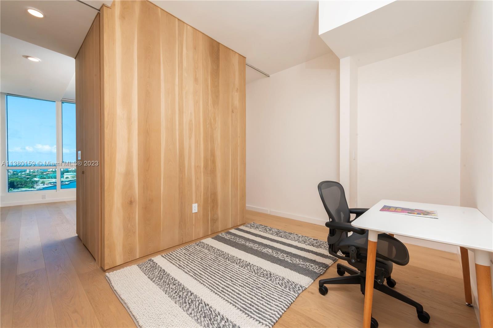 100 South Pointe Drive, Unit 1802 Miami Beach, FL 33139 - Photo 11 of 17 a view of a workspace with furniture and a window