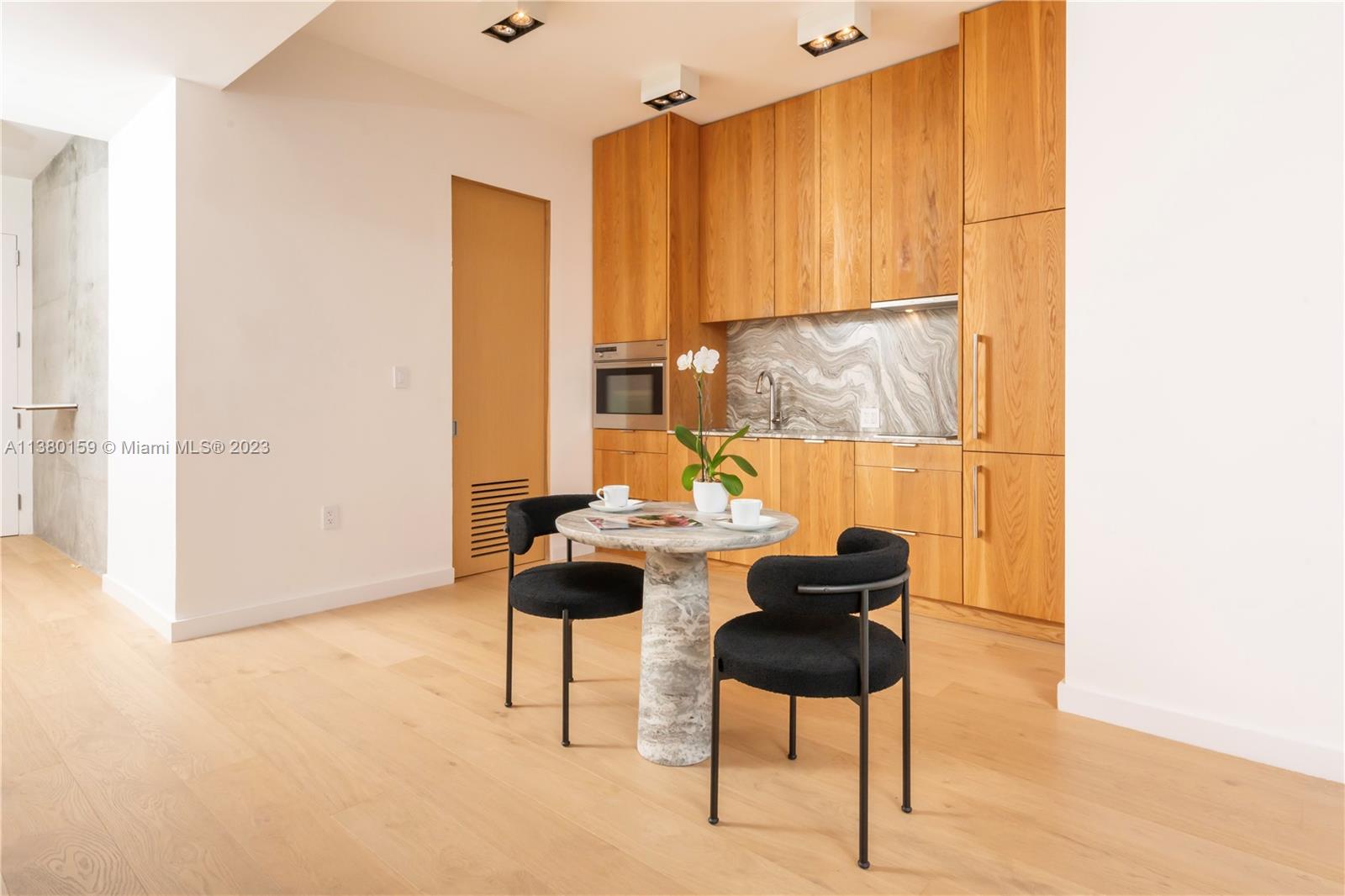 100 South Pointe Drive, Unit 1802 Miami Beach, FL 33139 - Photo 6 of 17 a kitchen with a sink and a cabinets