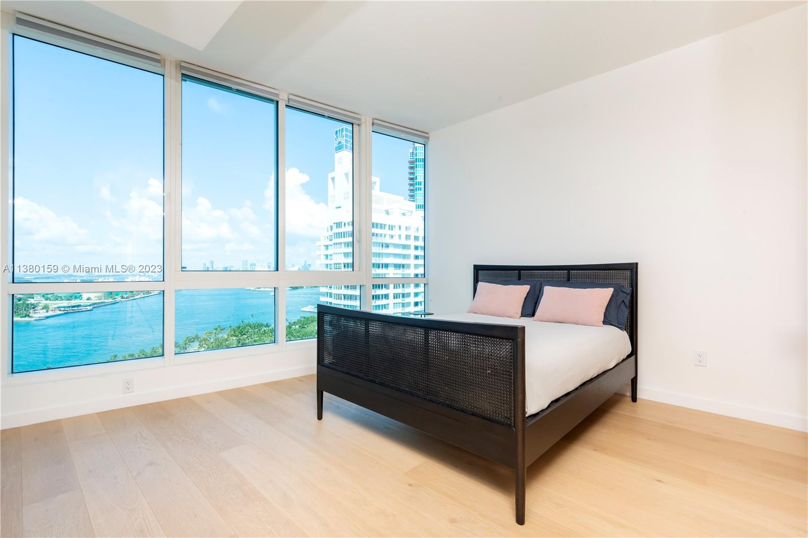 100 South Pointe Drive, Unit 1802 Miami Beach, FL 33139 - Photo 9 of 17 a view of bedroom with furniture and balcony
