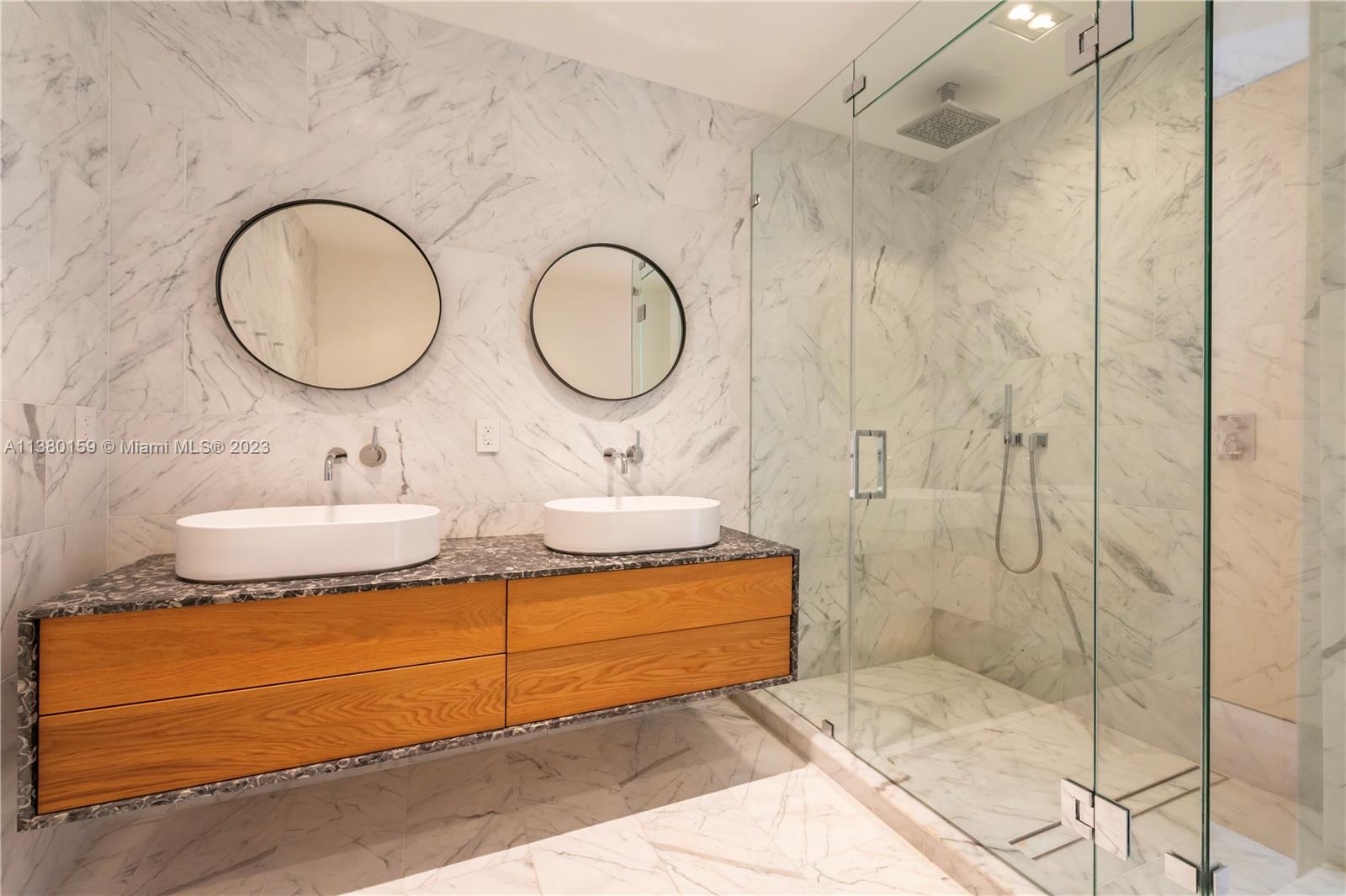 100 South Pointe Drive, Unit 1802 Miami Beach, FL 33139 - Photo 10 of 17 a bathroom with a sink and a mirror