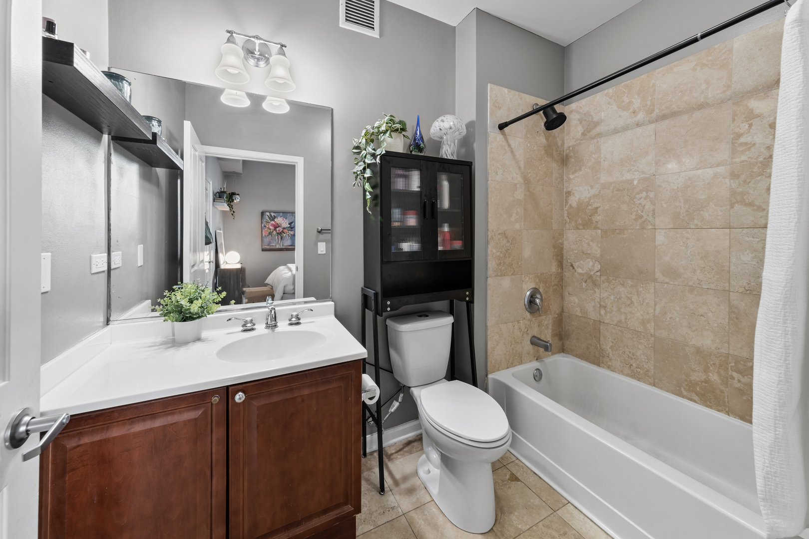 1464 South Michigan Avenue, Unit 1107 Chicago, IL 60605 - Photo 12 of 20 a bathroom with a sink a toilet and shower