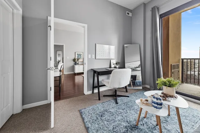 a view of a dining room with furniture and a table