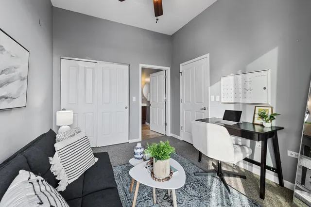 a bathroom with a sink a toilet a mirror a vanity and bathtub